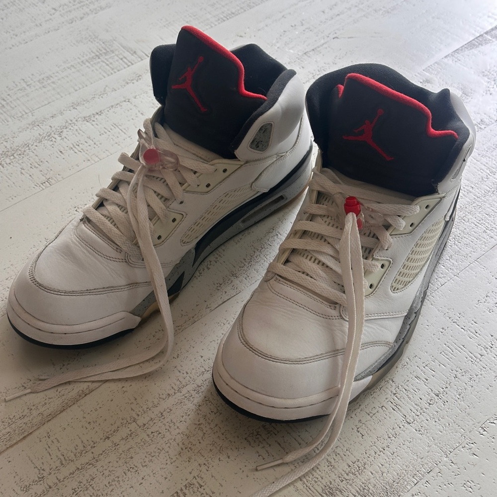 White and Black Air Jordan 5 Retros with Red Accents
